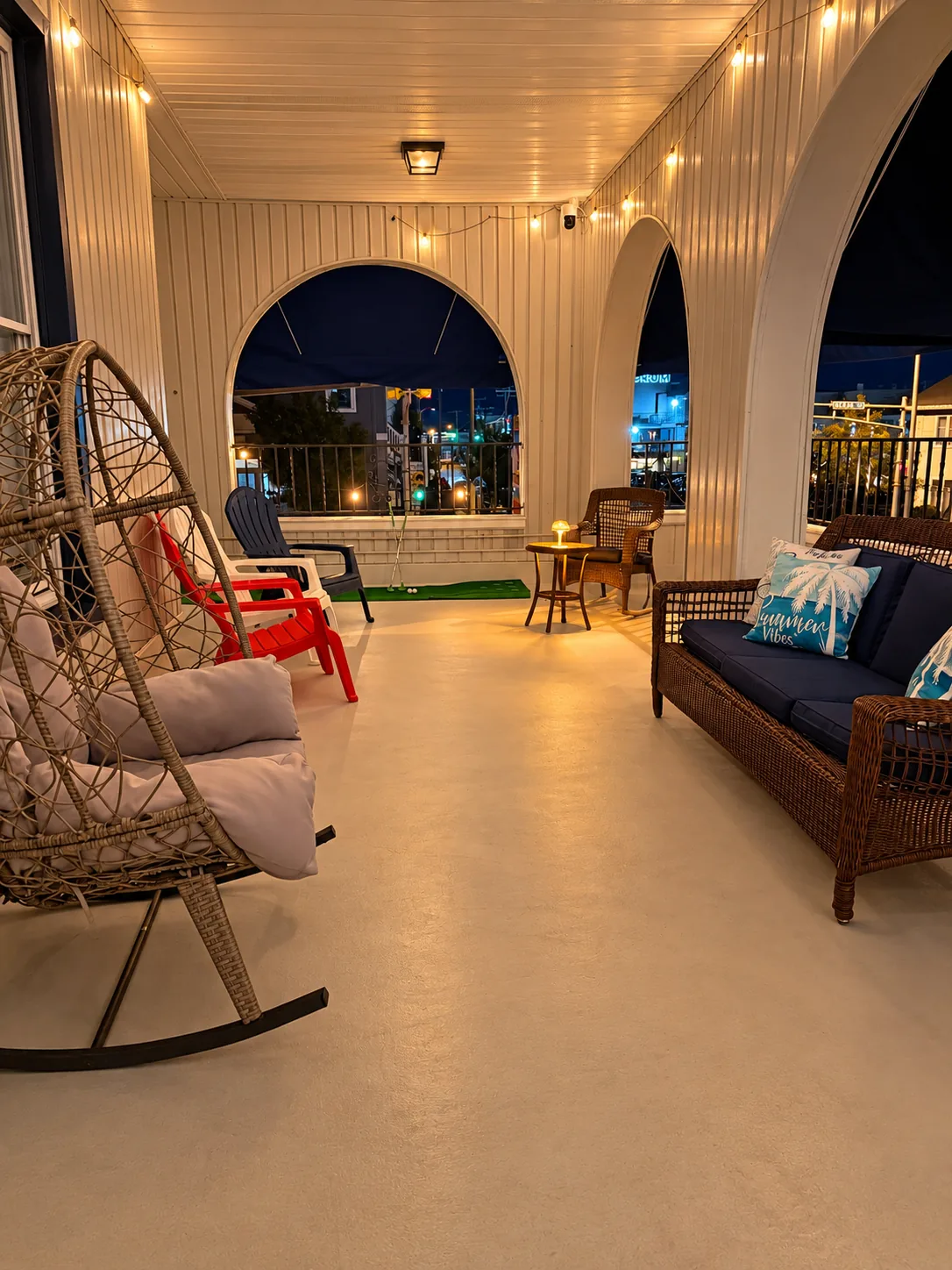 The Linda Grande Hotel wraparound porch with rocking chairs in the evening